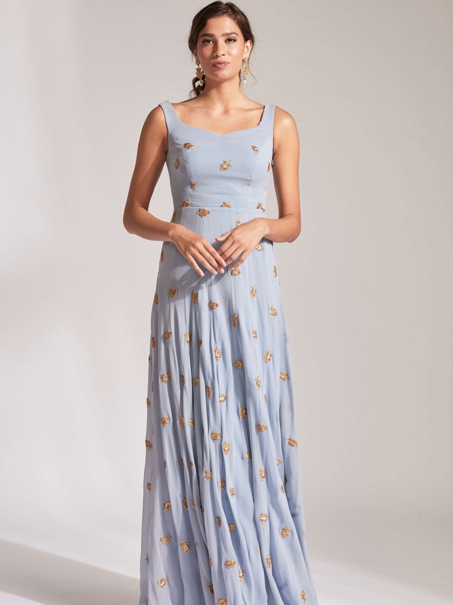 The Anita Anarkali is a dusty blue anarkali featuring a silk crepe dupatta in cream with booti work and border.