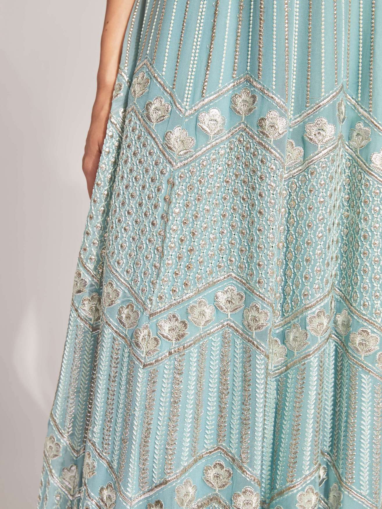The Anjali Anarkali features metallic layered embroidery and is paired with an attached dupatta (so you can't lose or trip on it).