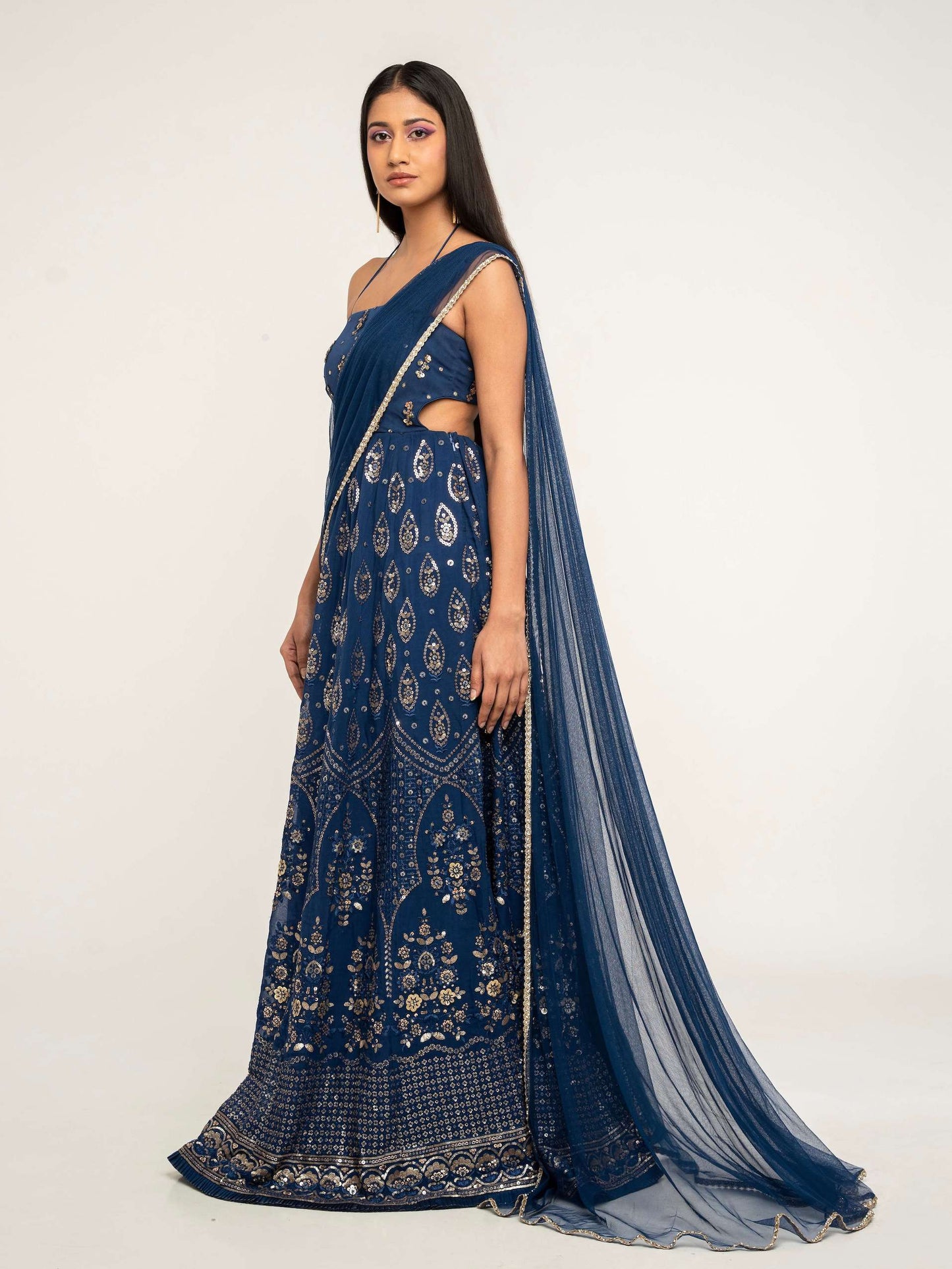 The Cutout Anarkali is an open-back, sequin gown paired with an attached dupatta (so you can't lose or trip on it).