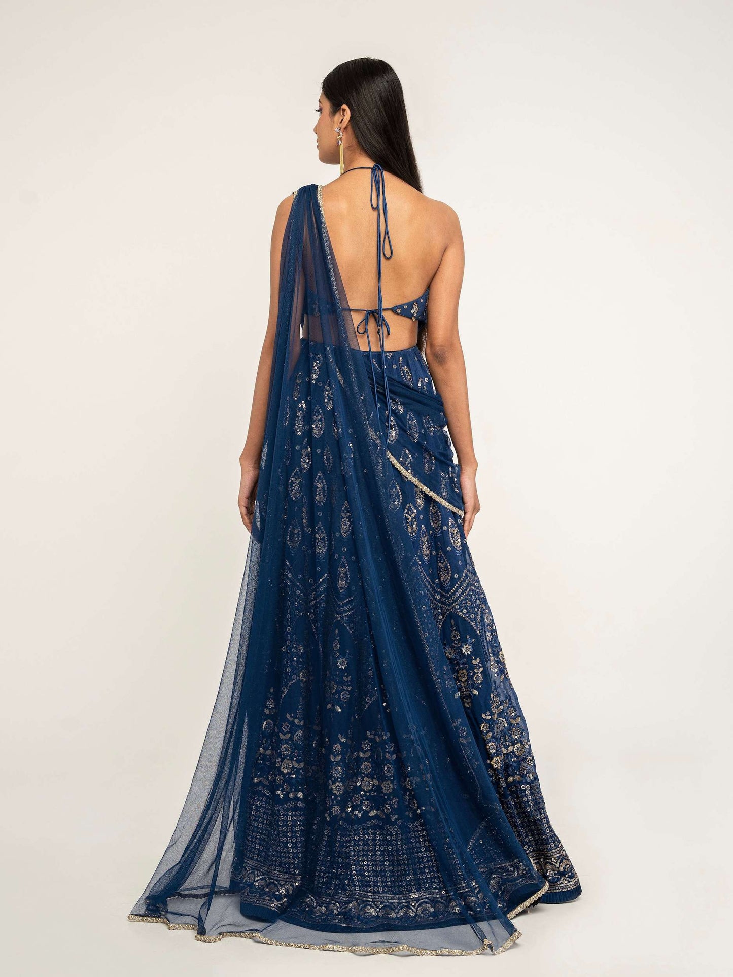 The Cutout Anarkali is an open-back, sequin gown paired with an attached dupatta (so you can't lose or trip on it).