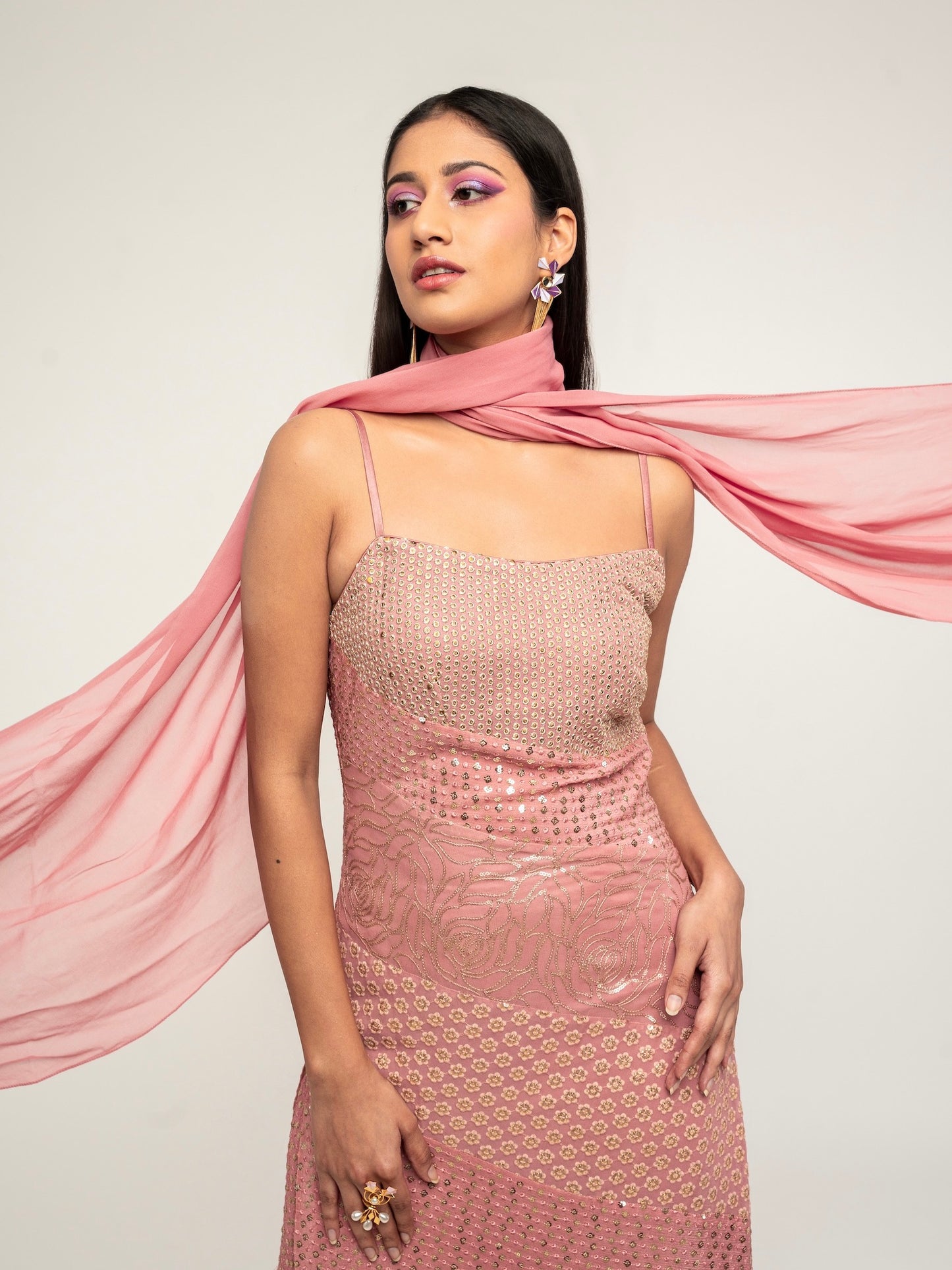 The Harleen Palazzo Set consists of a dress, palazzo pants, and a skinny dupatta. It is a patchwork design featuring 4 unique, embroidered fabrics.