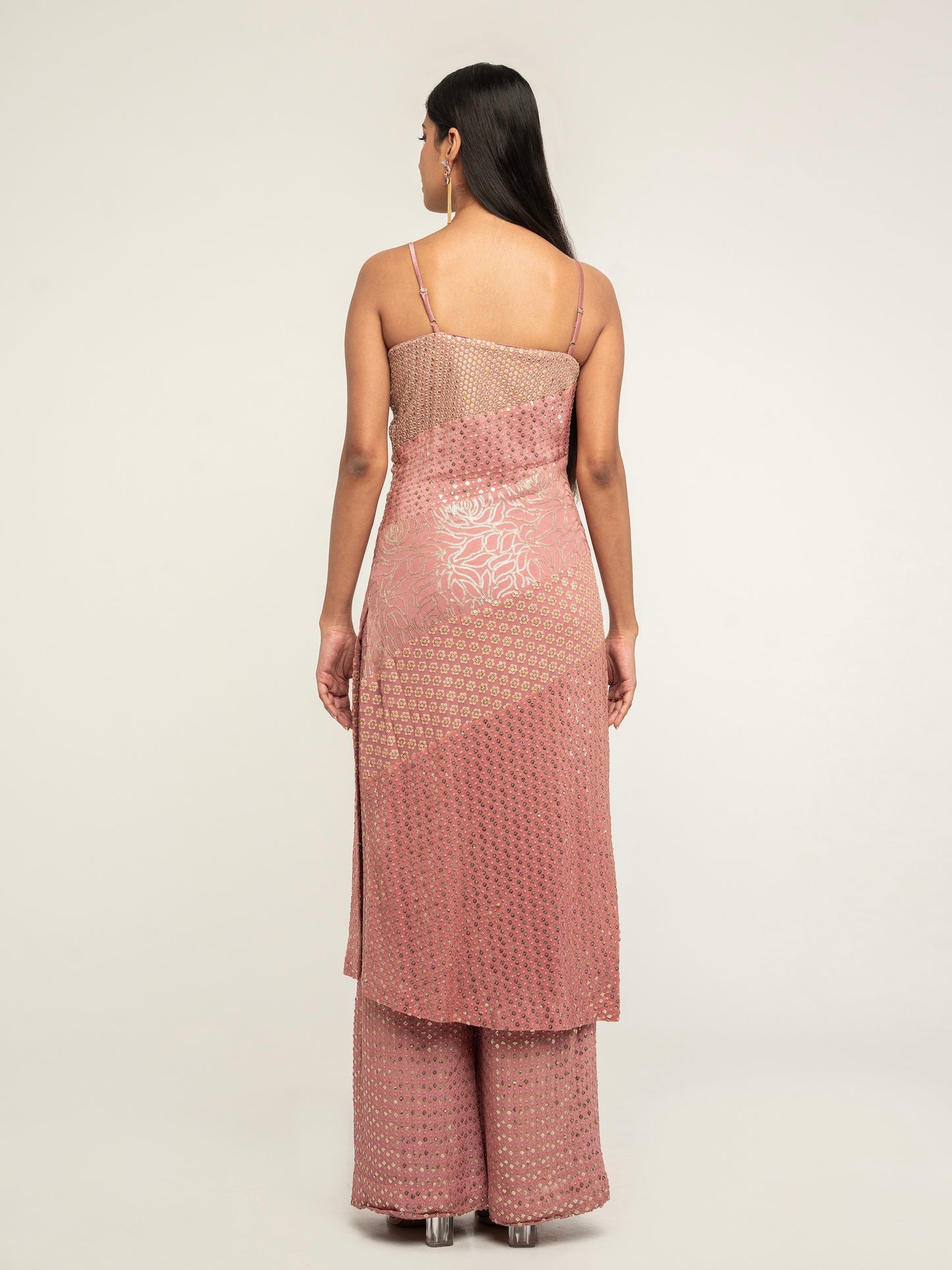 The Harleen Palazzo Set consists of a dress, palazzo pants, and a skinny dupatta. It is a patchwork design featuring 4 unique, embroidered fabrics.