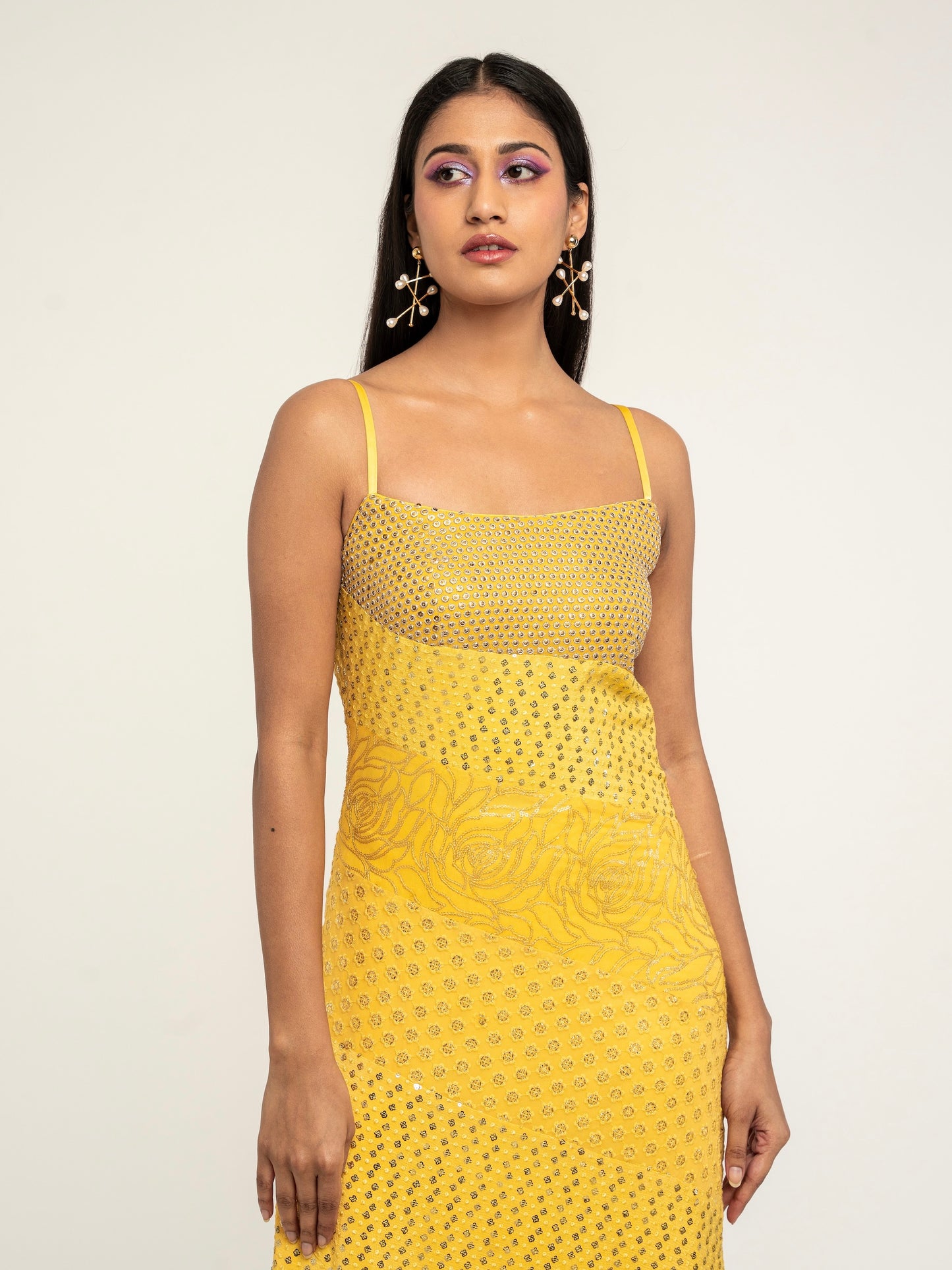 The Harleen Palazzo Set consists of a dress, palazzo pants, and a skinny dupatta. It is a patchwork design featuring 4 unique, embroidered fabrics.