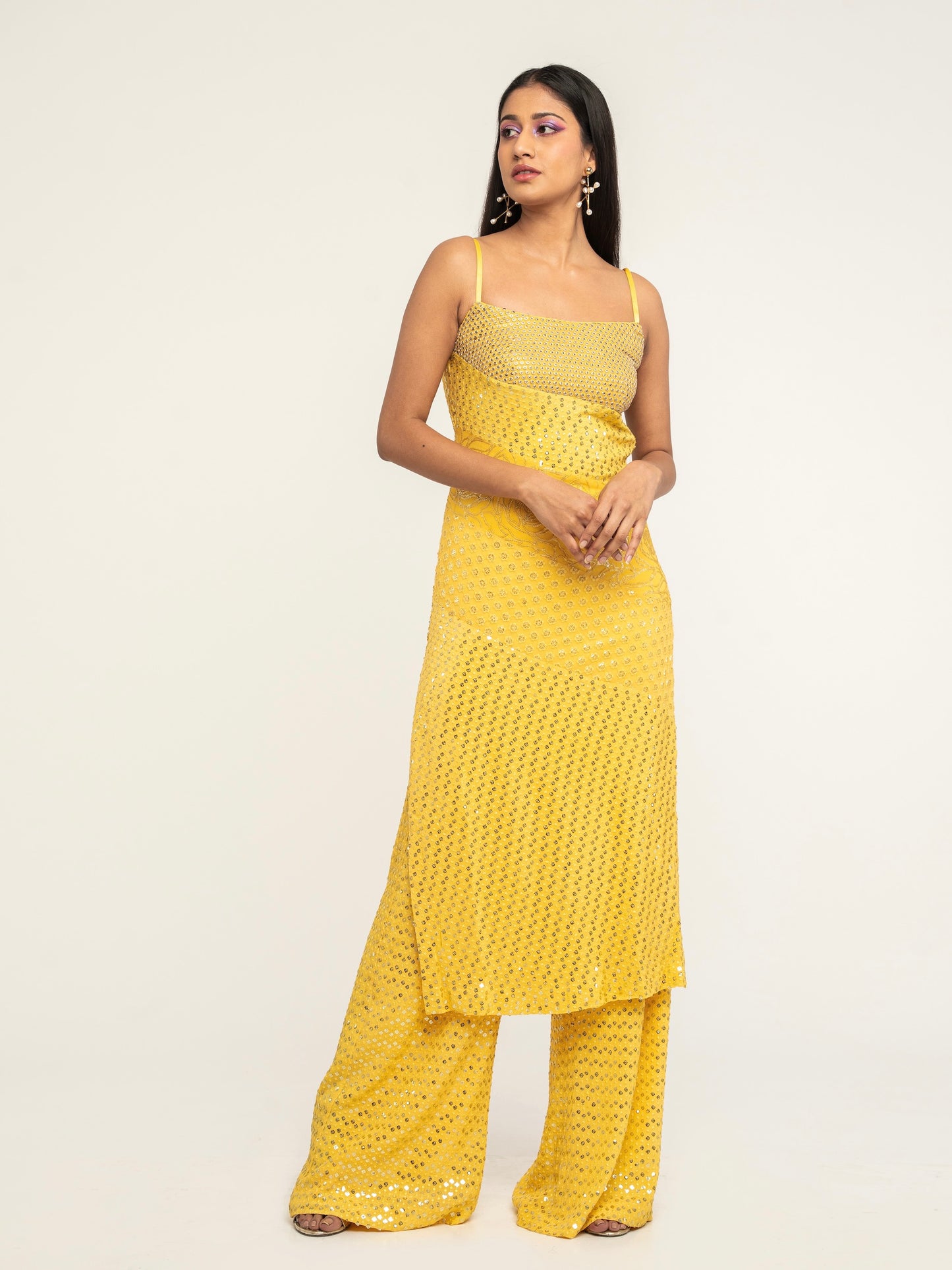The Harleen Palazzo Set consists of a dress, palazzo pants, and a skinny dupatta. It is a patchwork design featuring 4 unique, embroidered fabrics.