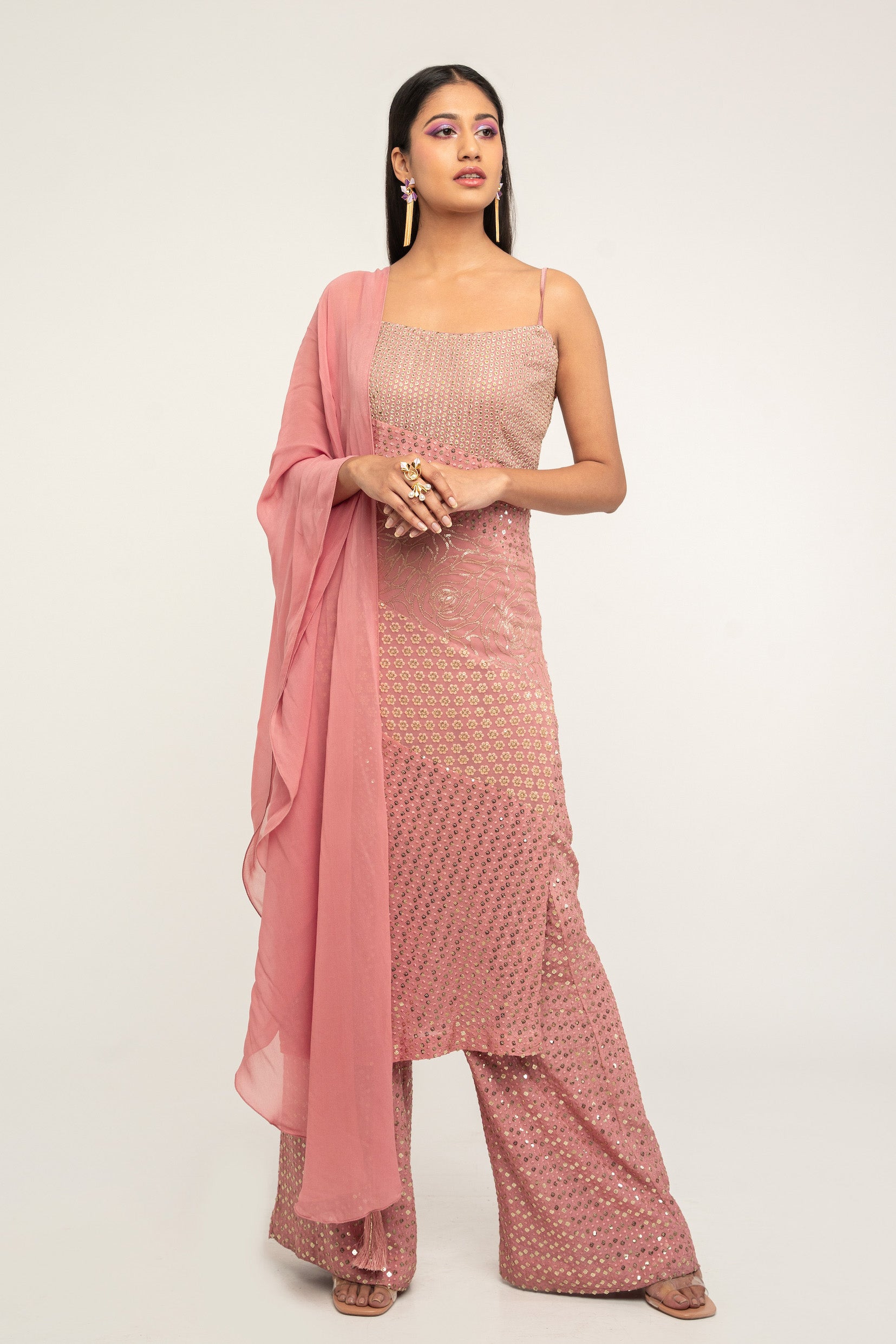The Harleen Palazzo Set consists of a dress, palazzo pants, and a skinny dupatta. It is a patchwork design featuring 4 unique, embroidered fabrics.