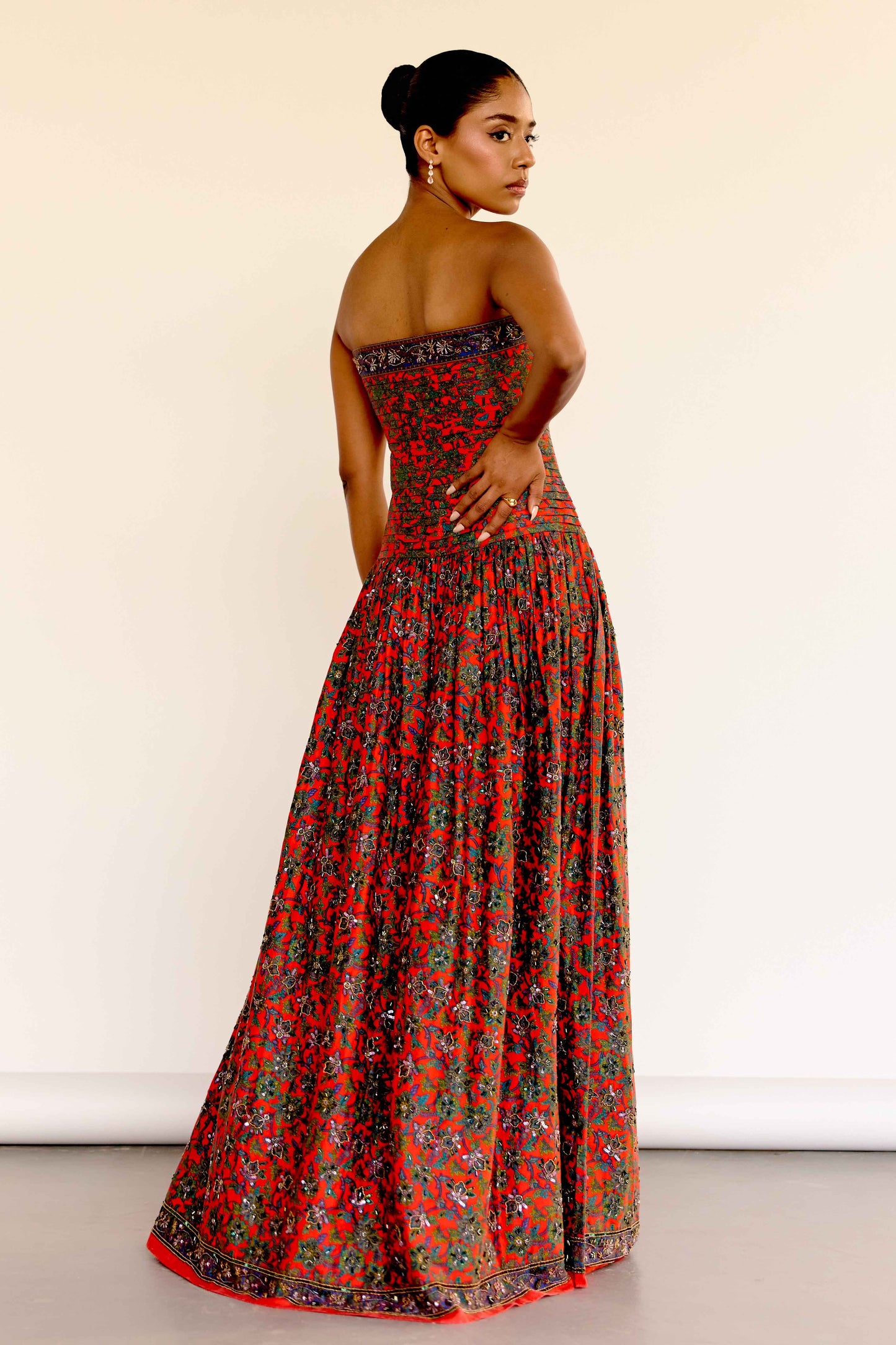 This limited-edition version of the Maya Dress features hand-beaded embellishments that bring new dimension to the vintage-inspired floral print. Each bead is carefully placed by artisans to highlight the soft pleating on the bodice and the dreamy movement of the gathered skirt. 