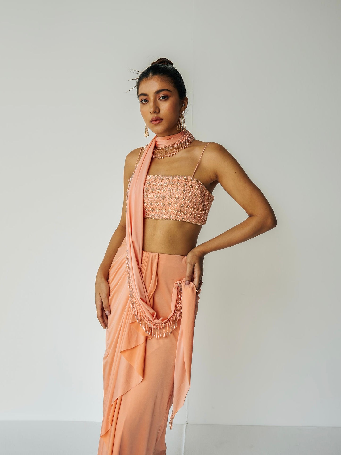 The Pearl Set features a hand embroidered pearl top, gathered skirt and skinny dupatta with pearl detailing.