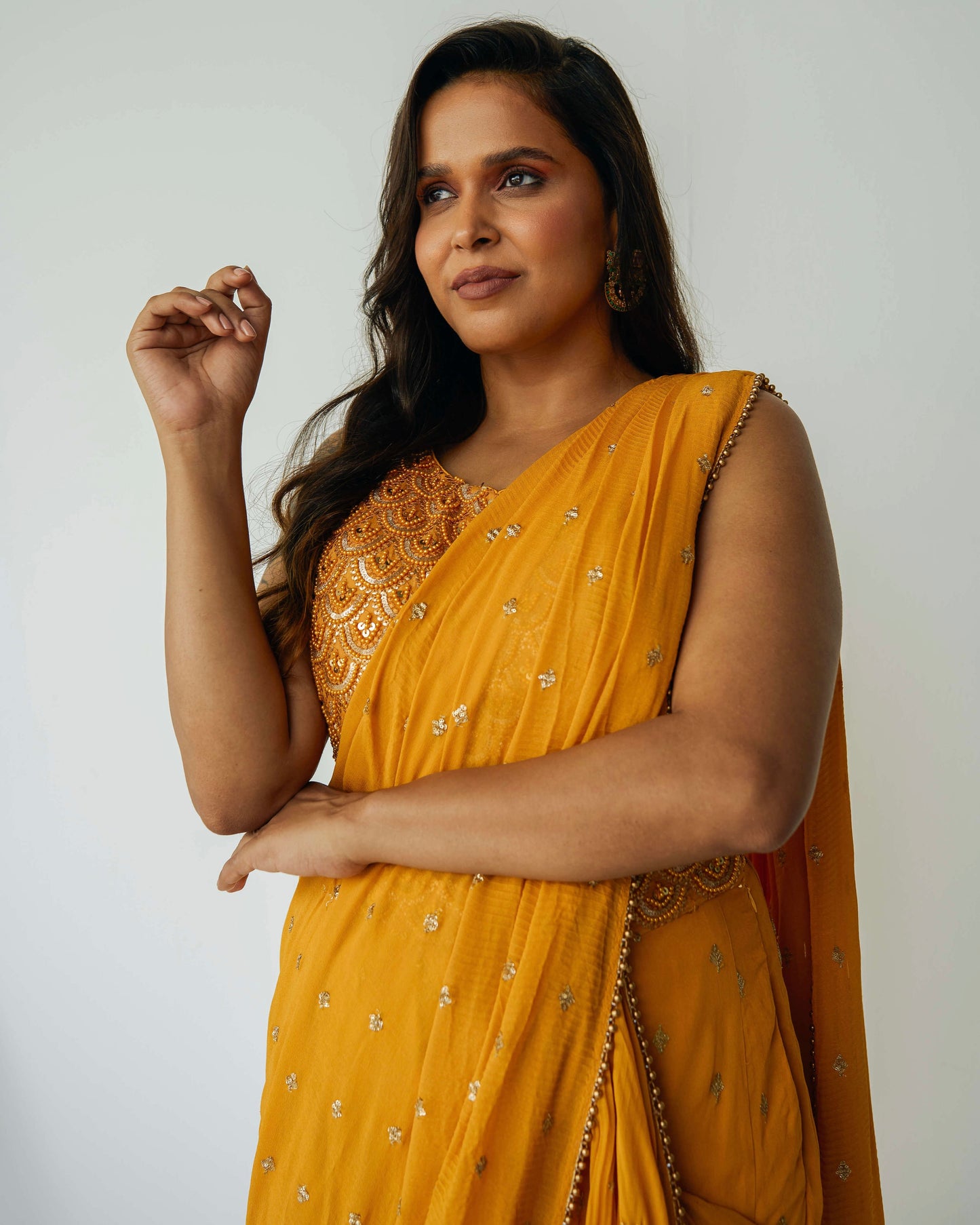 The Rani Palazzo 2.0 gives you the drape of a saree without any hassle. Featuring an all over embroidery on the pants and drape, and the blouse includes sequin work with accent beading.