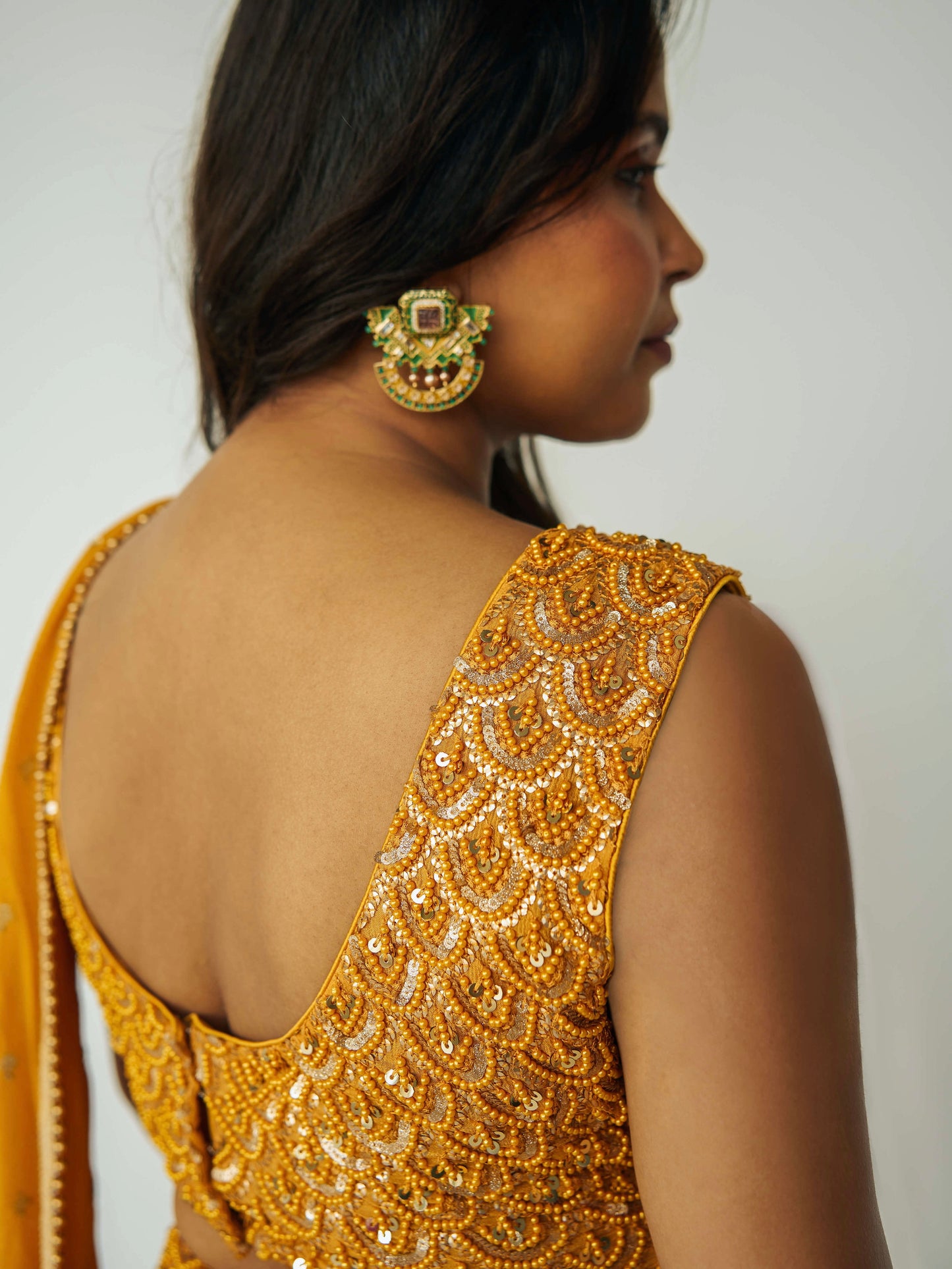 The Rani Palazzo 2.0 gives you the drape of a saree without any hassle. Featuring an all over embroidery on the pants and drape, and the blouse includes sequin work with accent beading.