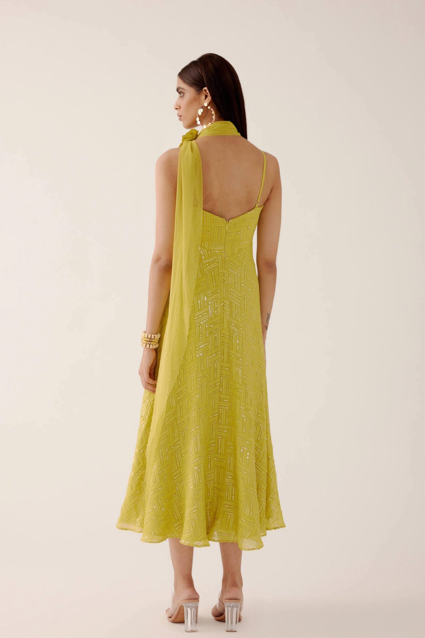 The Zara Dress is a midi-length dress with delicate sequin work throughout. The dress comes with a skinny dupatta and a detachable, handmade rosette clip. 