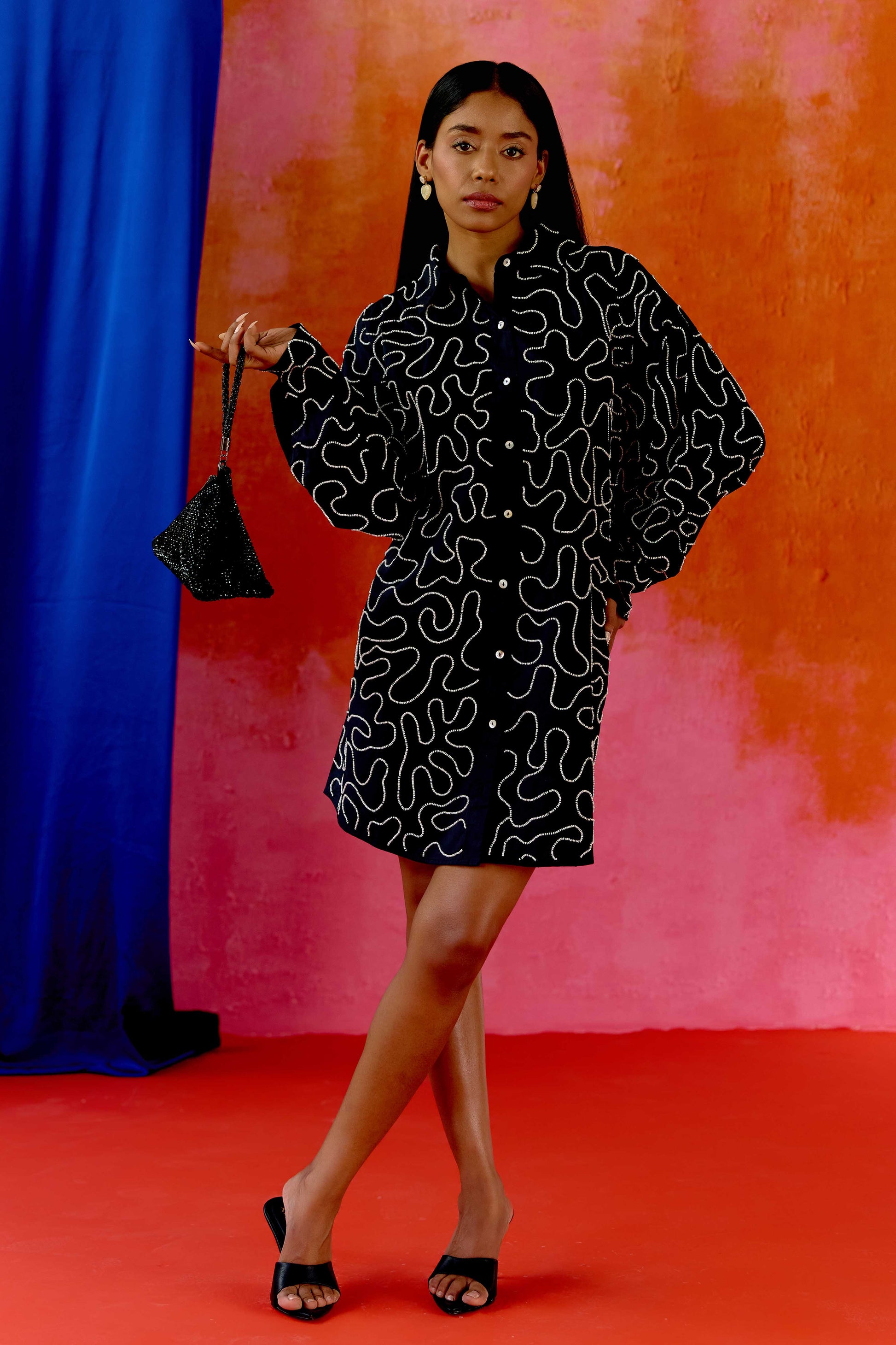 The Kira Dress is our twist on the classic shirt dress—tailored in silhouette but detailed with winding threadwork and subtle beading for just the right amount of drama. Made from soft 100% cotton and finished with contrast buttons, it's the kind of dress that works just as well with sneakers as it does with heels.
