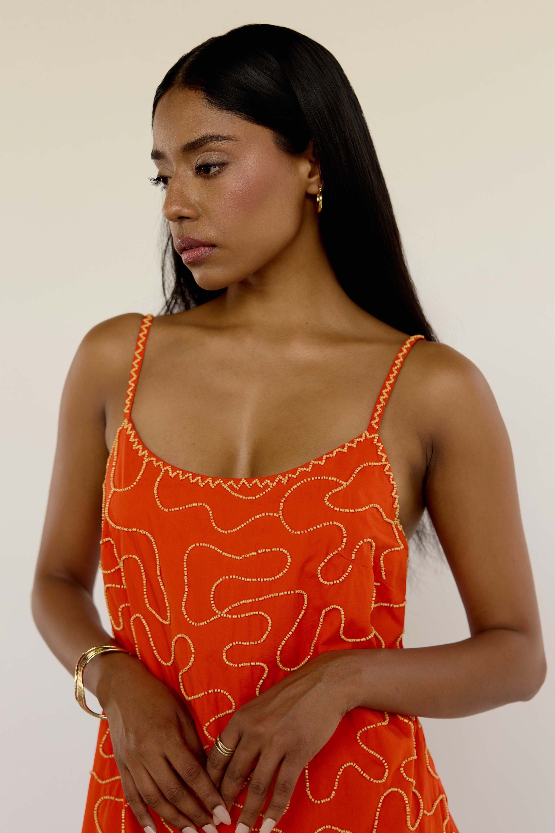 The Meera Dress is made from 100% cotton and features abstract, hand-beaded detailing that adds just the right amount of texture. With its vibrant orange hue and flattering mini silhouette, it’s an easy go-to for summer dinners, vacation nights, or whenever “subtle” just won’t cut it.