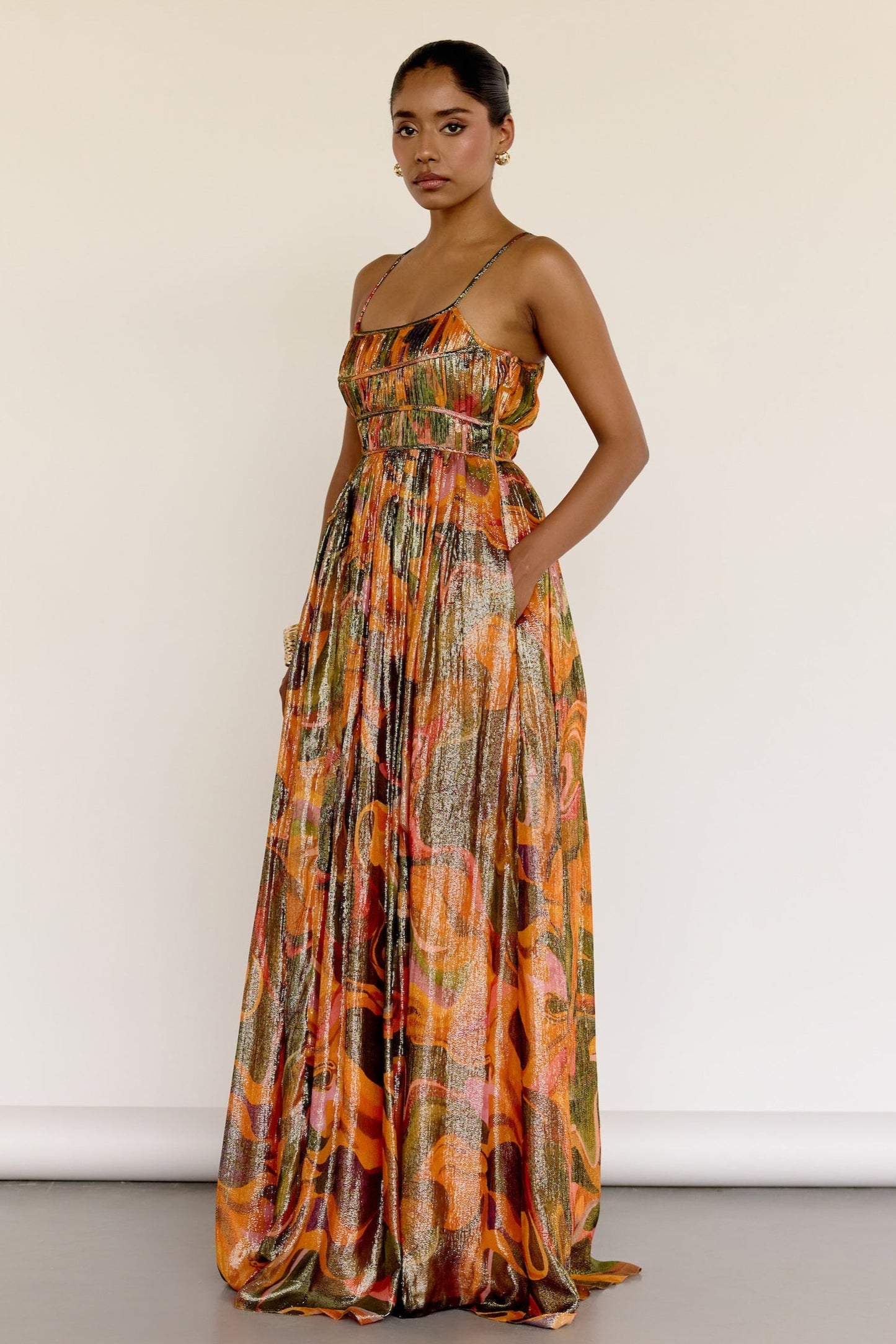 The Leela Dress features a subtle metallic print and a classic A-line silhouette. A fitted bodice gives way to a flowing skirt, creating a look that’s easy to wear and effortlessly polished.