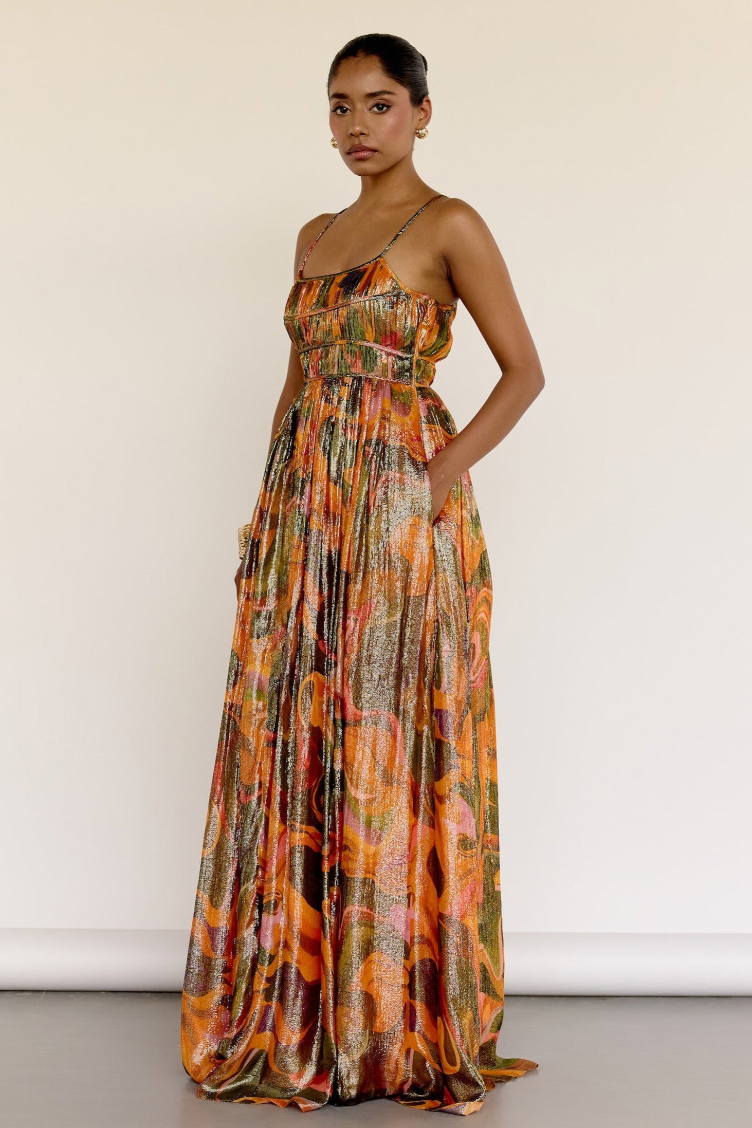 The Leela Dress features a subtle metallic print and a classic A-line silhouette. A fitted bodice gives way to a flowing skirt, creating a look that’s easy to wear and effortlessly polished.