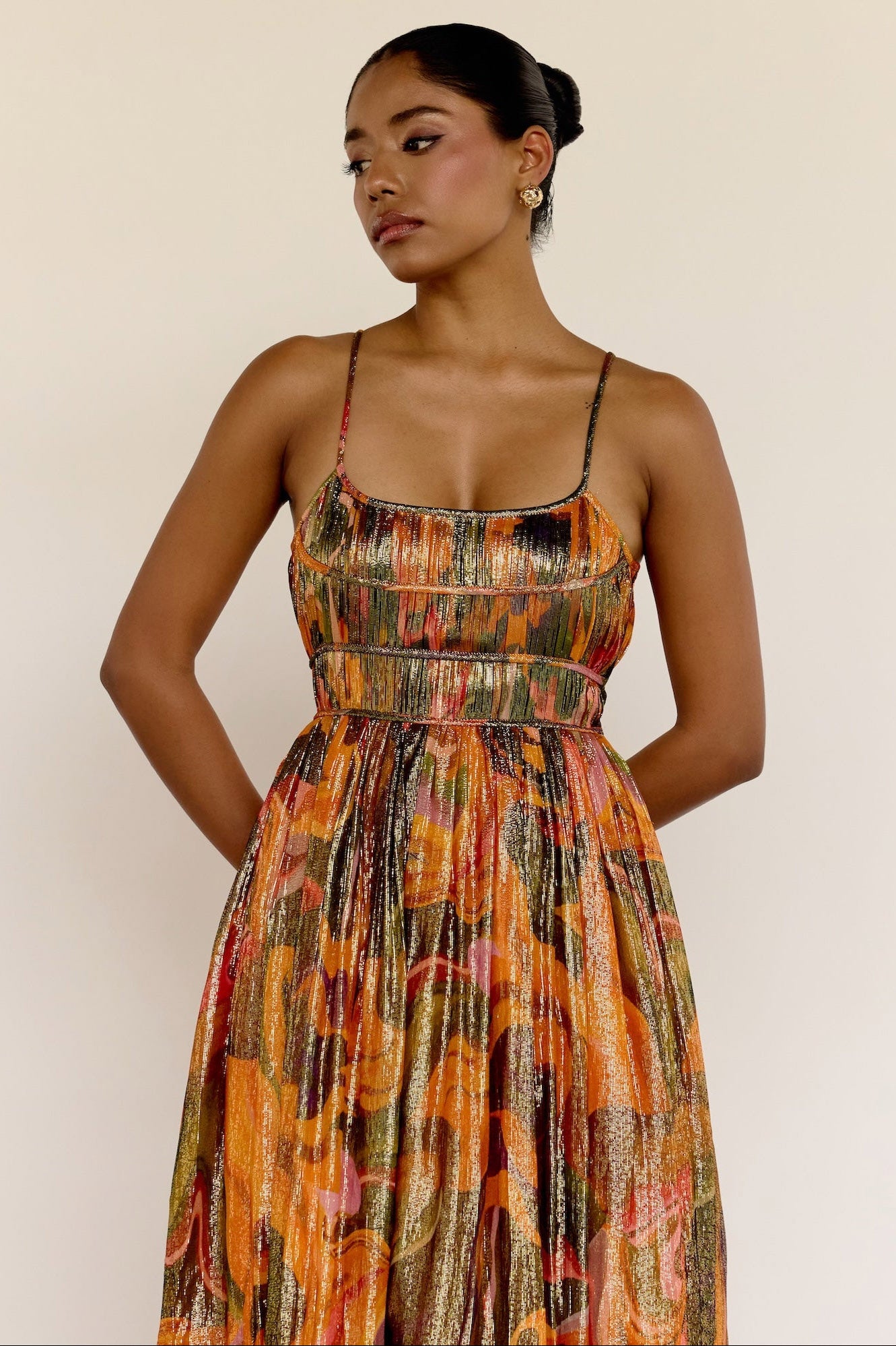 The Leela Dress features a subtle metallic print and a classic A-line silhouette. A fitted bodice gives way to a flowing skirt, creating a look that’s easy to wear and effortlessly polished.