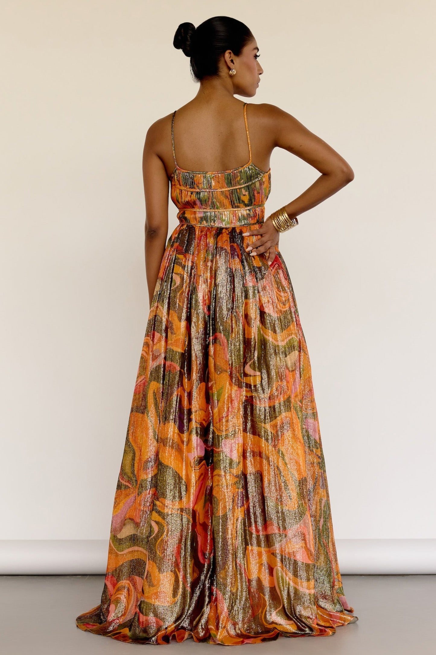 The Leela Dress features a subtle metallic print and a classic A-line silhouette. A fitted bodice gives way to a flowing skirt, creating a look that’s easy to wear and effortlessly polished.
