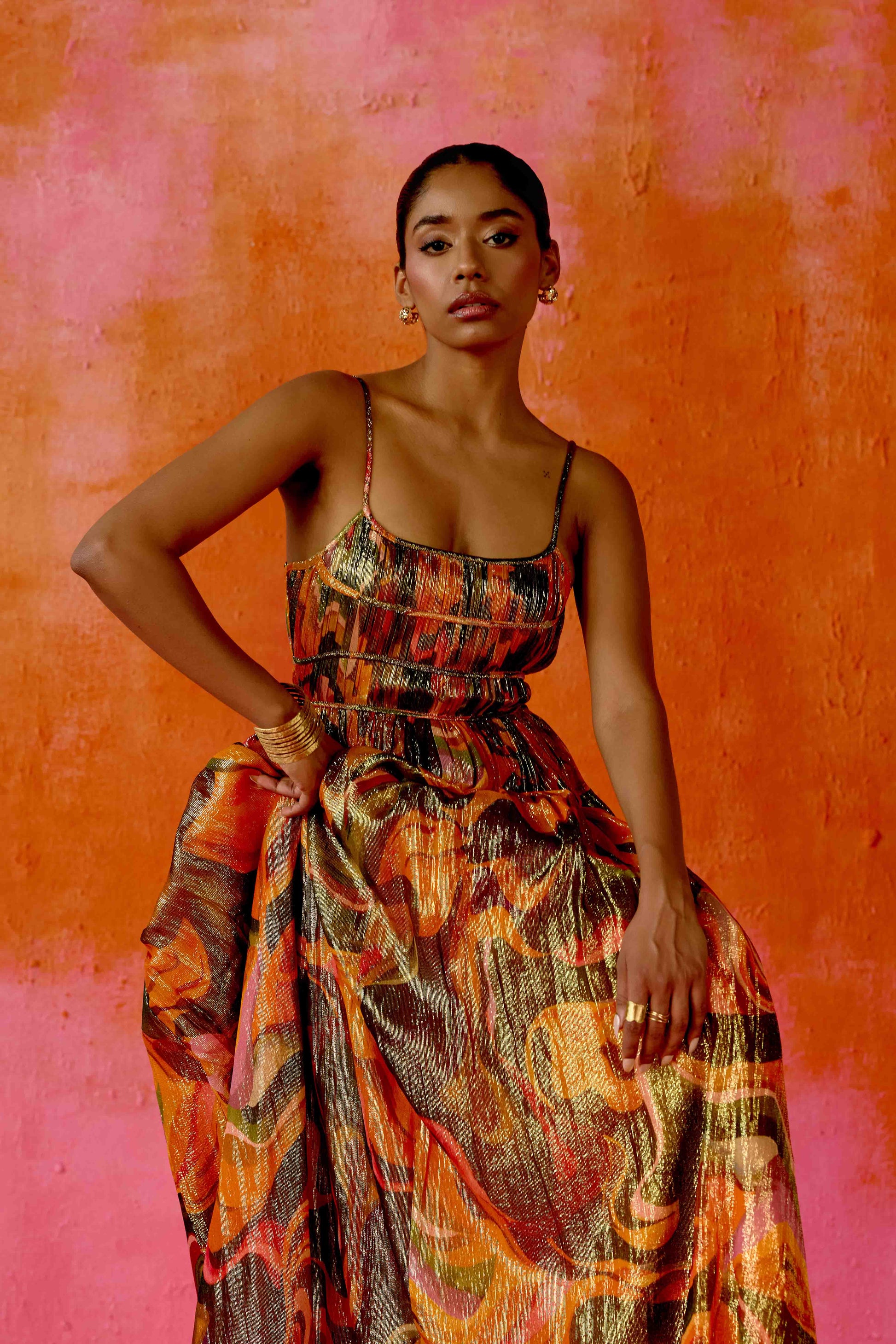 The Leela Dress features a subtle metallic print and a classic A-line silhouette. A fitted bodice gives way to a flowing skirt, creating a look that’s easy to wear and effortlessly polished.