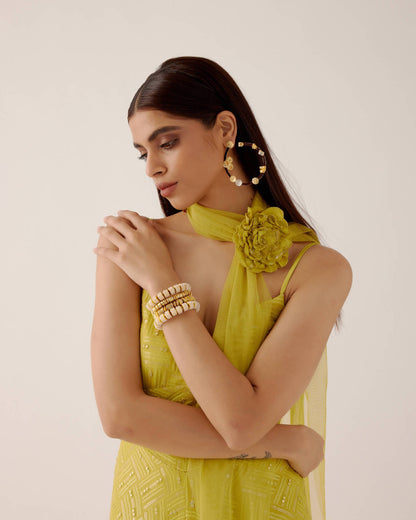 The Zara Dress is a midi-length dress with delicate sequin work throughout. The dress comes with a skinny dupatta and a detachable, handmade rosette clip. 