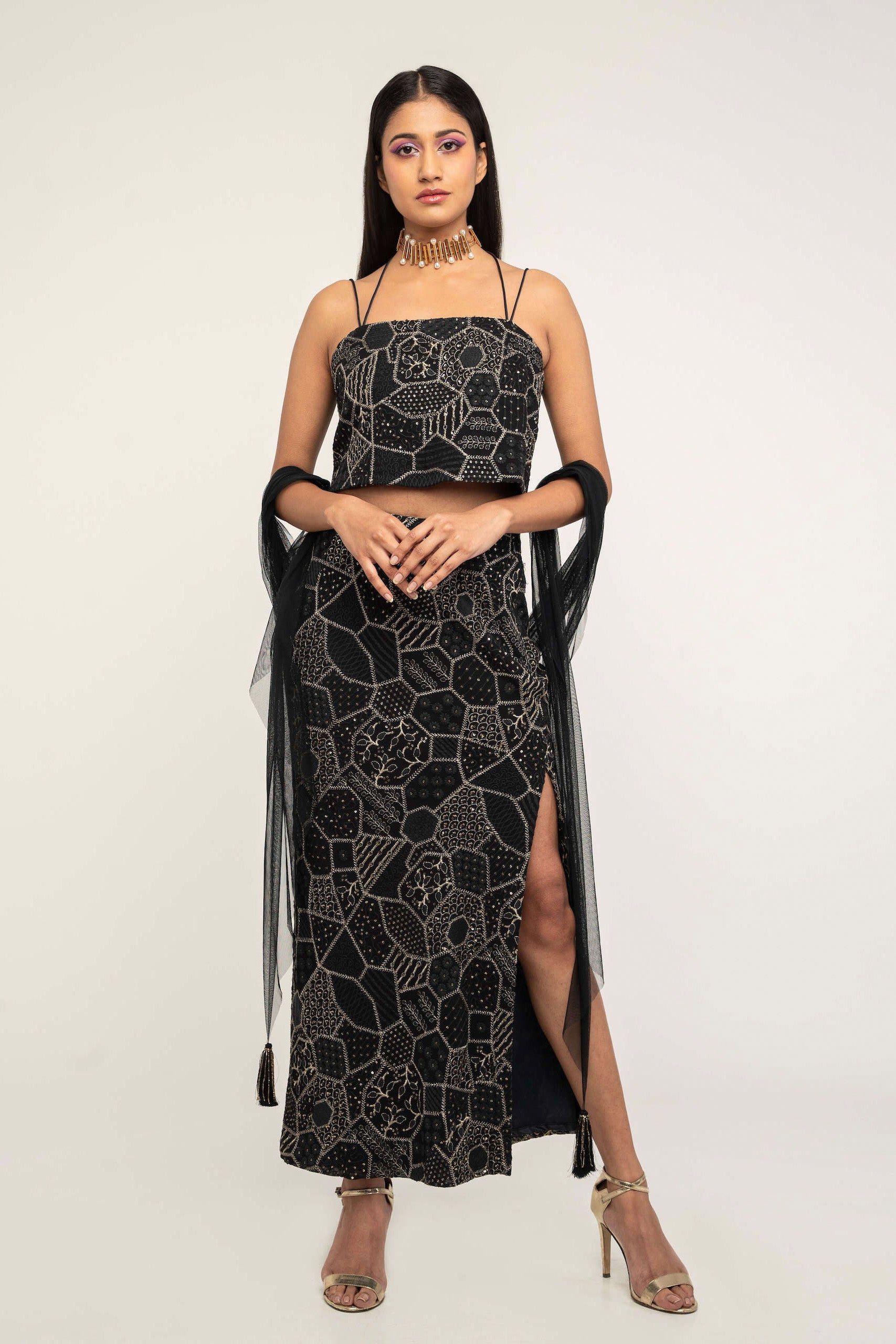 The Amara consists of a high-waisted, elastic waistband skirt with a spaghetti-strapped blouse and a skinny dupatta.