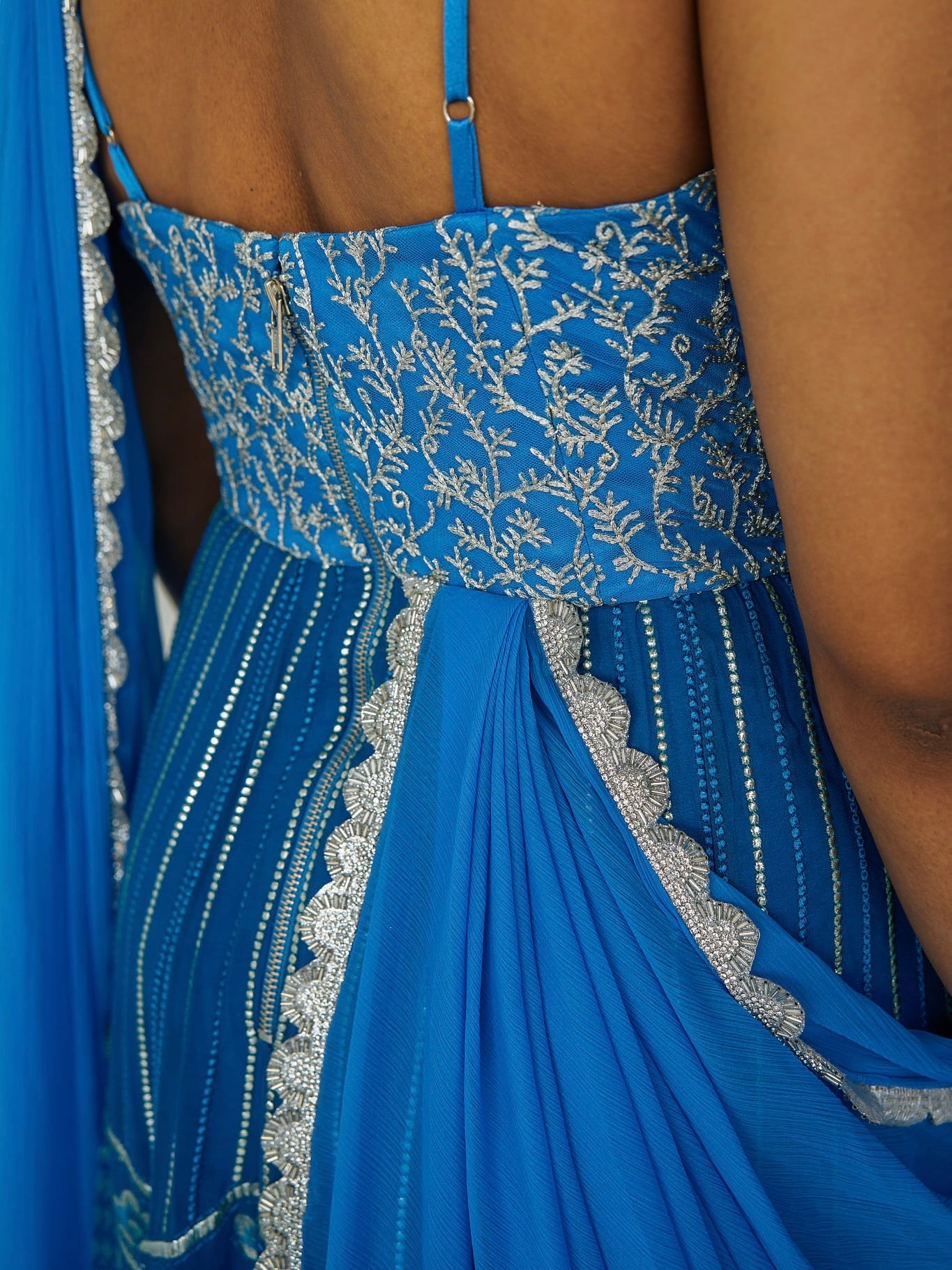 The Anjali Anarkali in cobalt features metallic layered embroidery and is paired with an attached dupatta (so you can't lose or trip on it).
