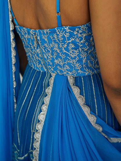 The Anjali Anarkali in cobalt features metallic layered embroidery and is paired with an attached dupatta (so you can't lose or trip on it).