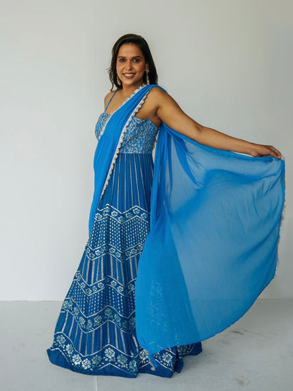 The Anjali Anarkali in cobalt features metallic layered embroidery and is paired with an attached dupatta (so you can't lose or trip on it).