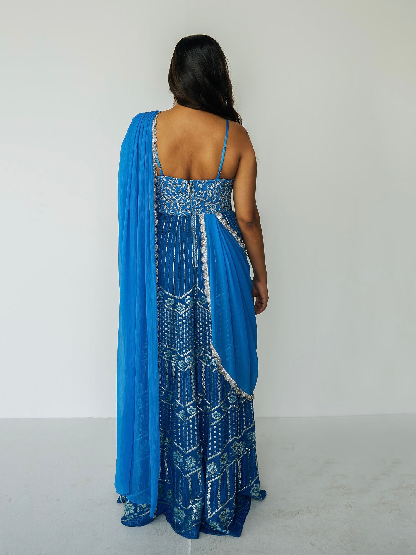 The Anjali Anarkali in cobalt features metallic layered embroidery and is paired with an attached dupatta (so you can't lose or trip on it).
