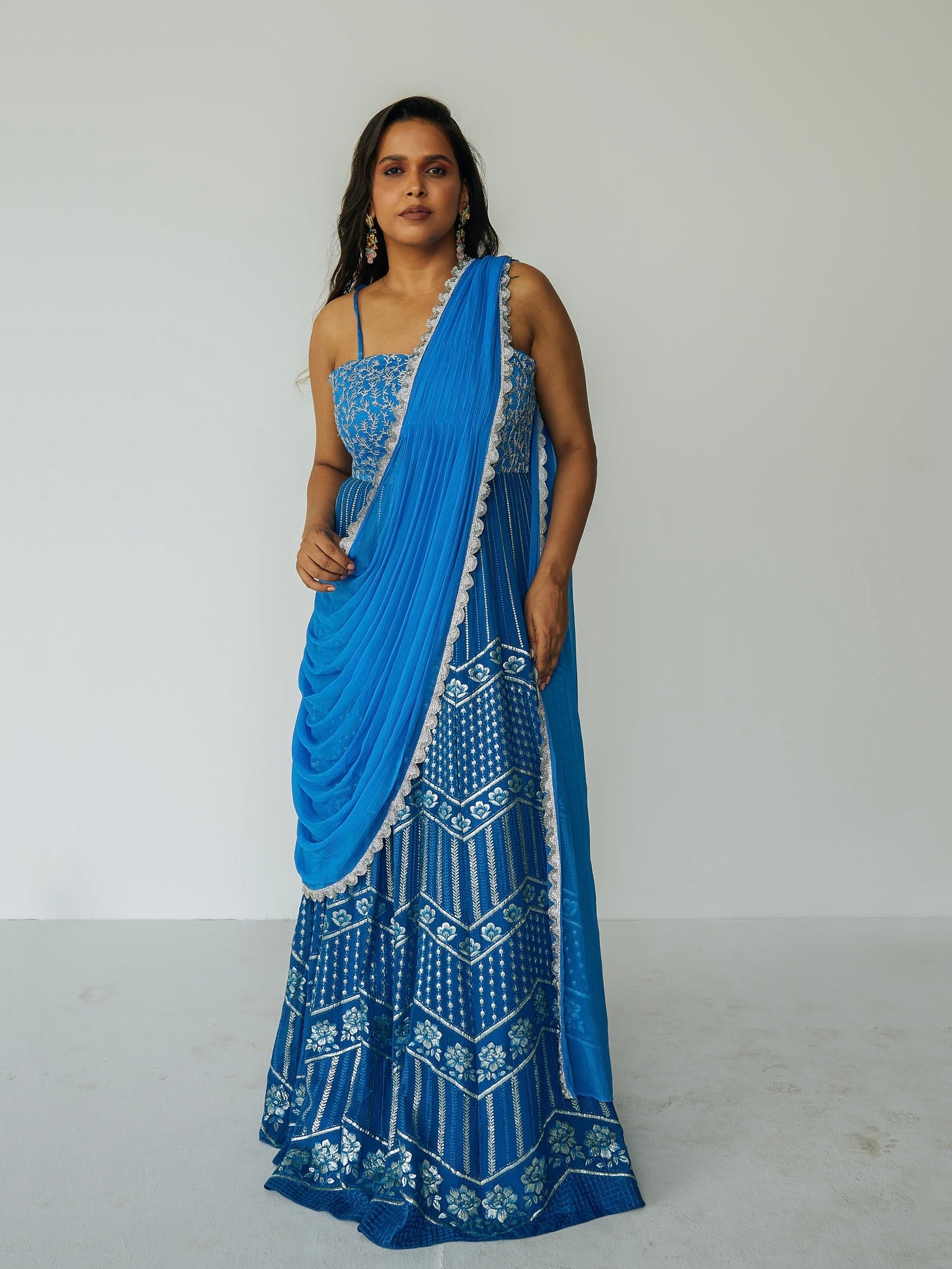 The Anjali Anarkali in cobalt features metallic layered embroidery and is paired with an attached dupatta (so you can't lose or trip on it).