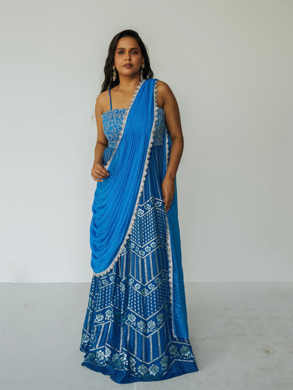 The Anjali Anarkali in cobalt features metallic layered embroidery and is paired with an attached dupatta (so you can't lose or trip on it).