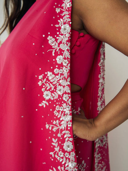 The Cleo Set consists of one shoulder top with hand-embroidered, high-waisted pants, and a detachable drape.