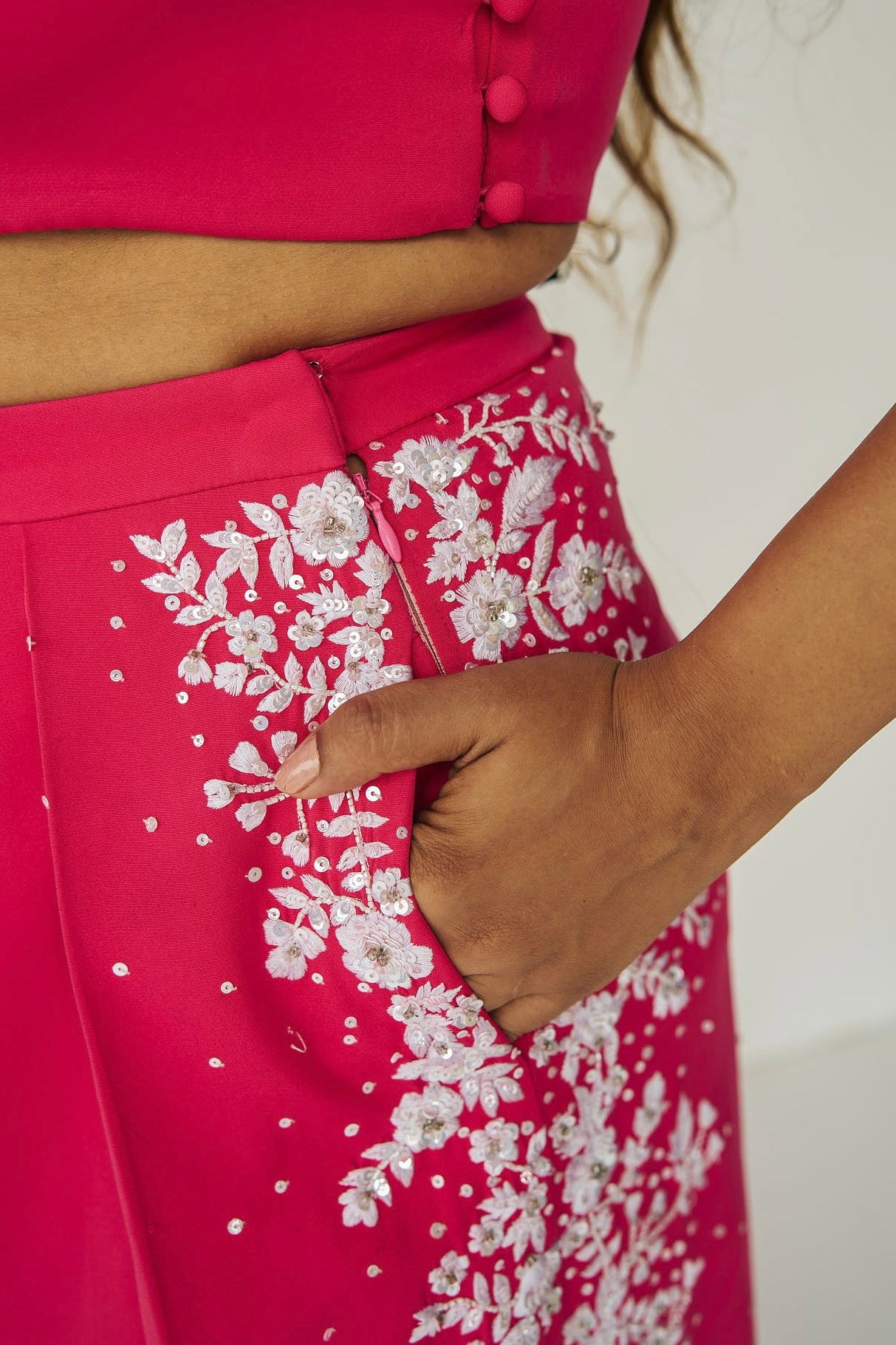 The Cleo Set consists of one shoulder top with hand-embroidered, high-waisted pants, and a detachable drape.