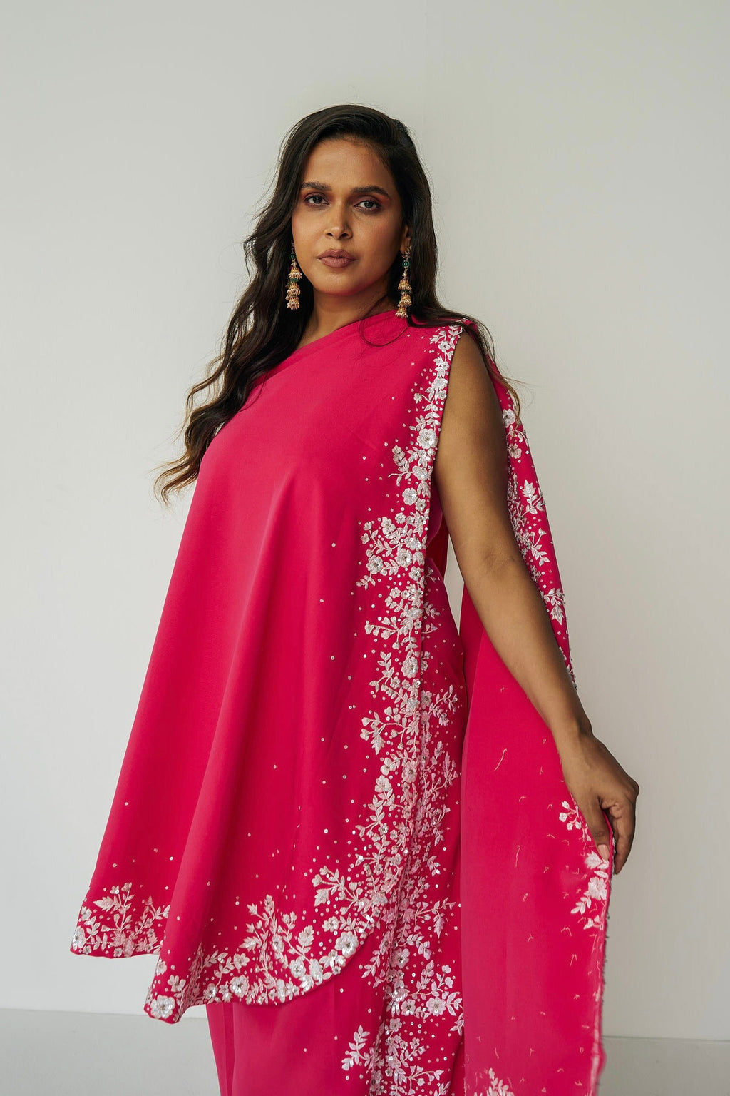 The Cleo Set consists of one shoulder top with hand-embroidered, high-waisted pants, and a detachable drape.