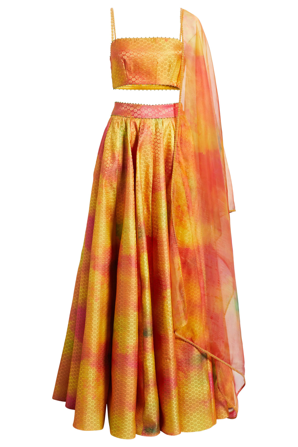 The Holi Lehenga features a printed brocade top with embroidered straps, a high-waisted skirt, and a lightweight printed organza dupatta. An easy lehenga for any celebration.