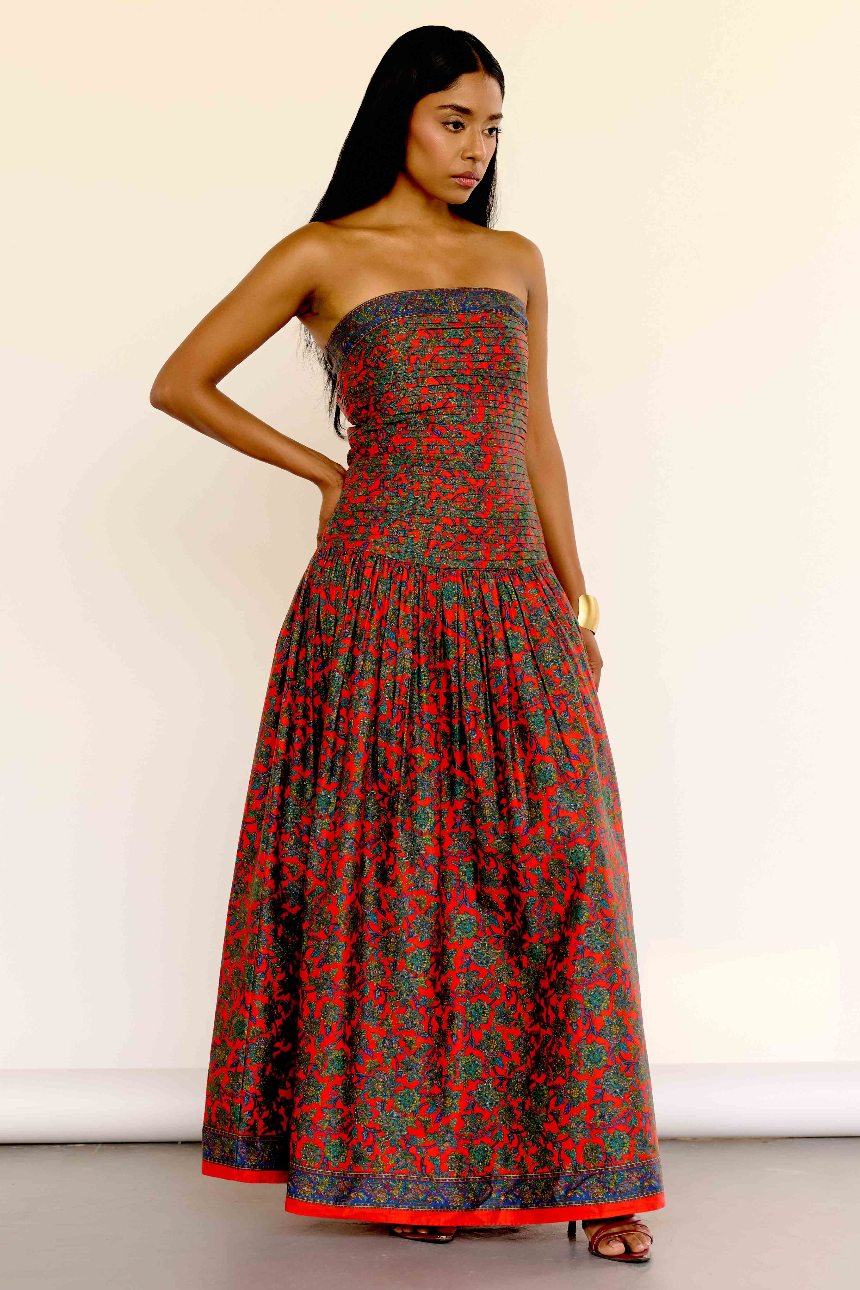 The Maya Dress features a vintage-inspired floral print. It’s strapless with a drop waist, a pleated bodice, and a softly gathered skirt.&nbsp;