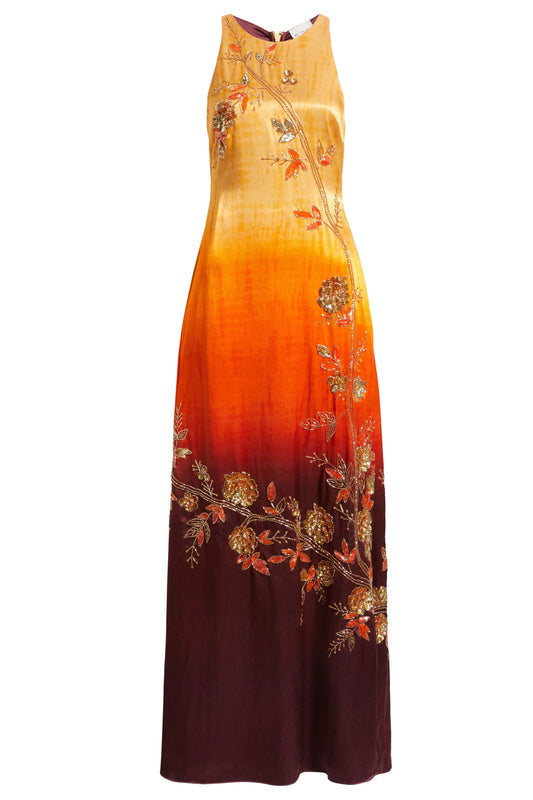 The Mya Anarkali features a high halter neckline and detailed vine and floral embroidery that runs from top to bottom. The ombré color shifts from yellow to orange to brown, and the dress includes pockets for added functionality.