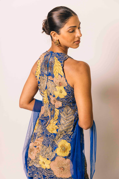 The Nidhi Gharara features intricate floral sequin work throughout the hand-embroidered mini dress, paired with silky gharara pants and a skinny dupatta. The outfit ALSO can be worn as a mini dress.