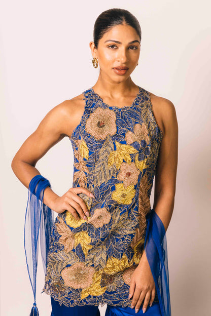 The Nidhi Gharara features intricate floral sequin work throughout the hand-embroidered mini dress, paired with silky gharara pants and a skinny dupatta. The outfit ALSO can be worn as a mini dress.