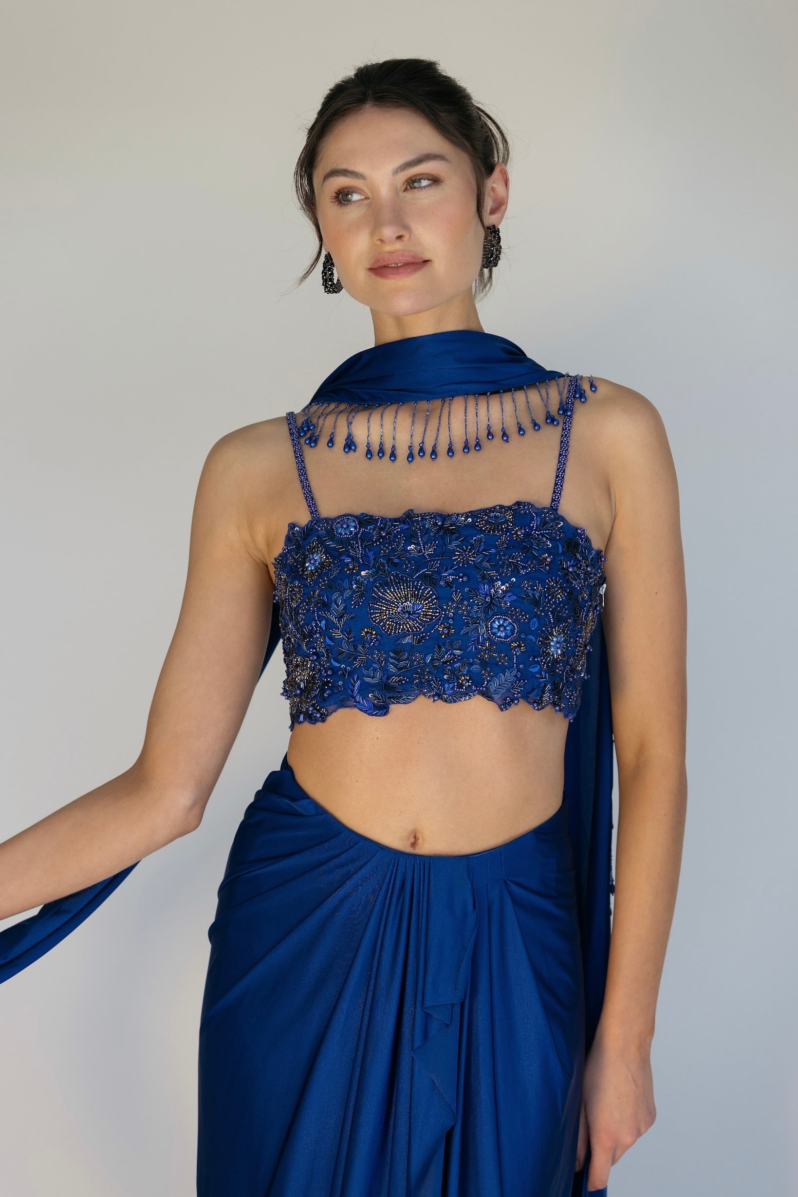 The Niki Set features a hand embroidered top, gathered skirt and skinny dupatta with pearl detailing.