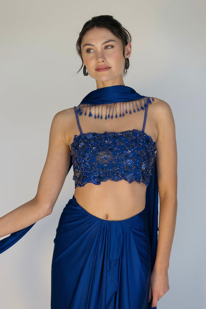 The Niki Set features a hand embroidered top, gathered skirt and skinny dupatta with pearl detailing.
