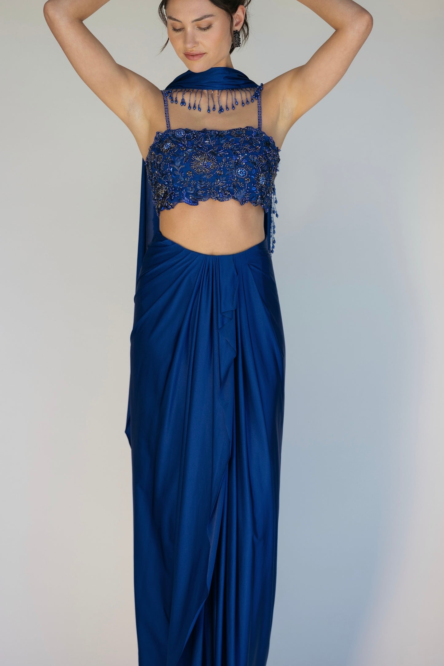 The Niki Set features a hand embroidered top, gathered skirt and skinny dupatta with pearl detailing.