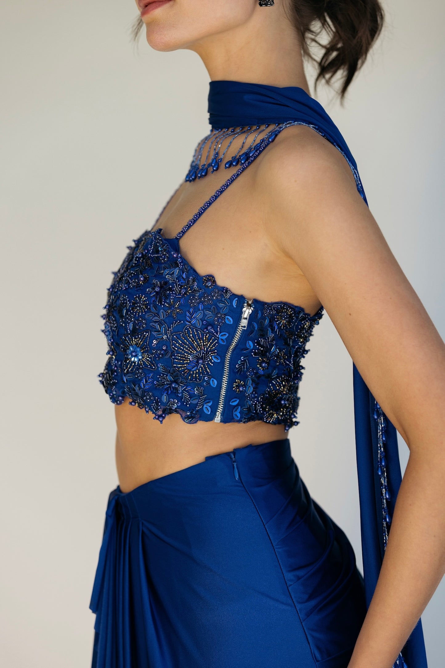 The Niki Set features a hand embroidered top, gathered skirt and skinny dupatta with pearl detailing.