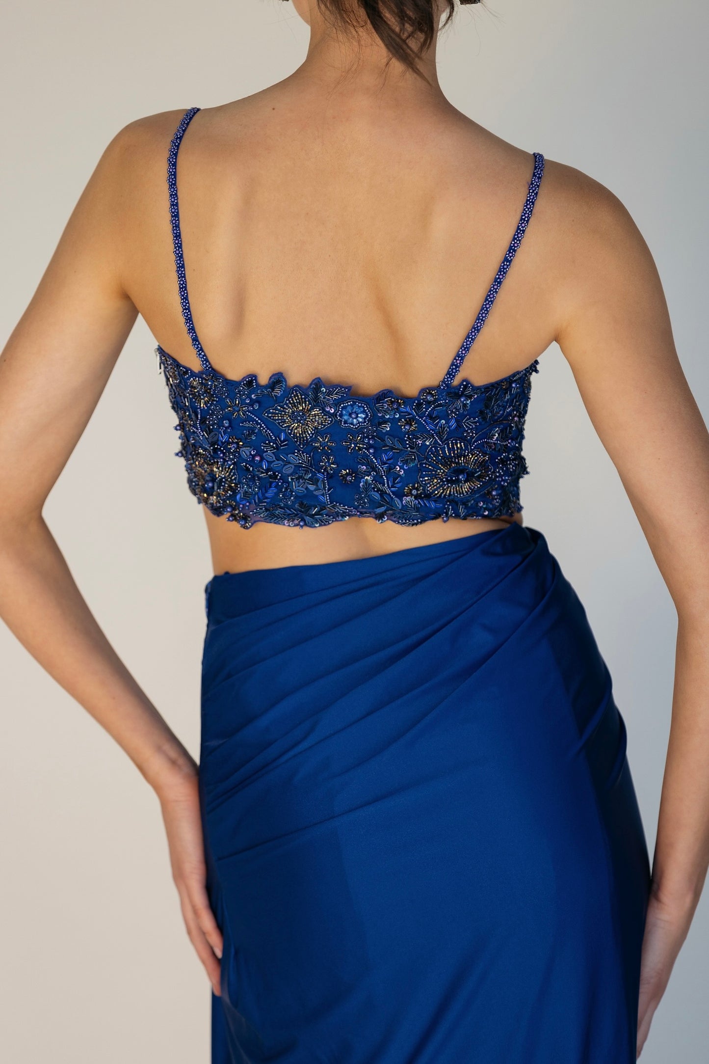 The Niki Set features a hand embroidered top, gathered skirt and skinny dupatta with pearl detailing.