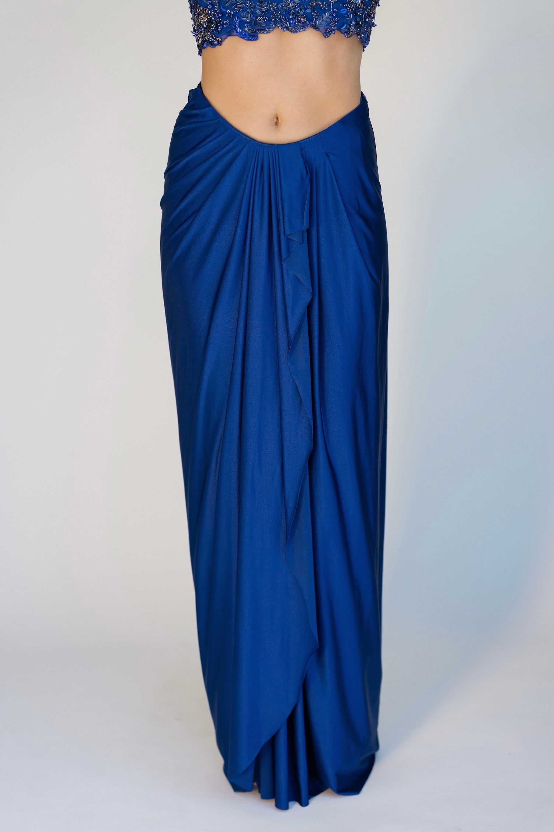 The Niki Set features a hand embroidered top, gathered skirt and skinny dupatta with pearl detailing.