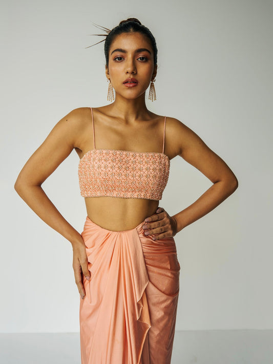 The Pearl Set features a hand embroidered pearl top, gathered skirt and skinny dupatta with pearl detailing.