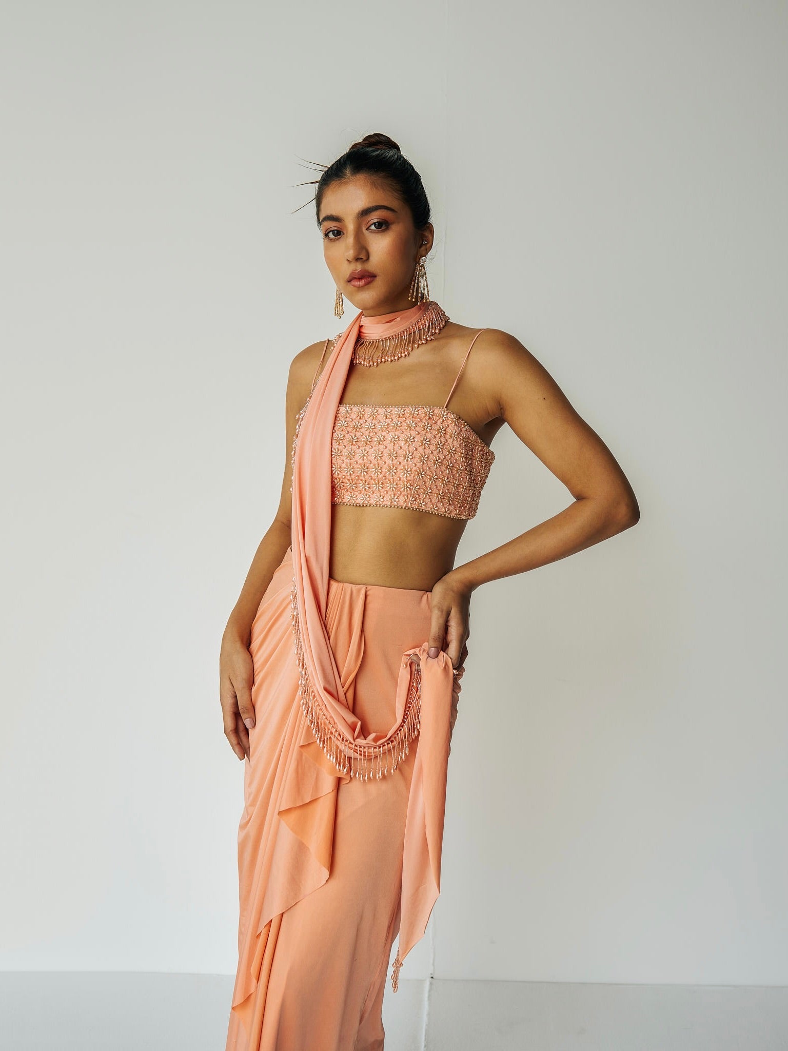 The Pearl Set features a hand embroidered pearl top, gathered skirt and skinny dupatta with pearl detailing.