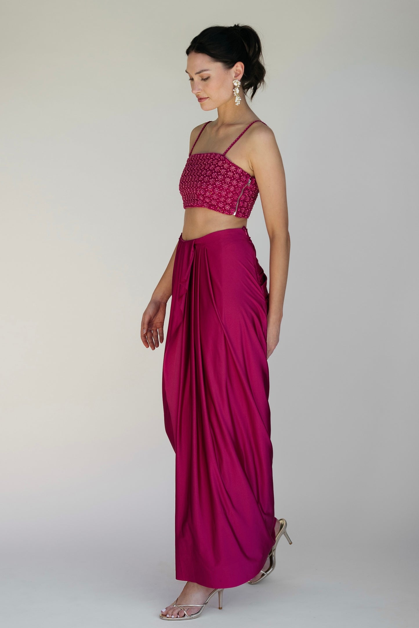 The Pearl Set features a hand embroidered pearl top, pleated skirt and skinny dupatta with pearl tassel detailing.