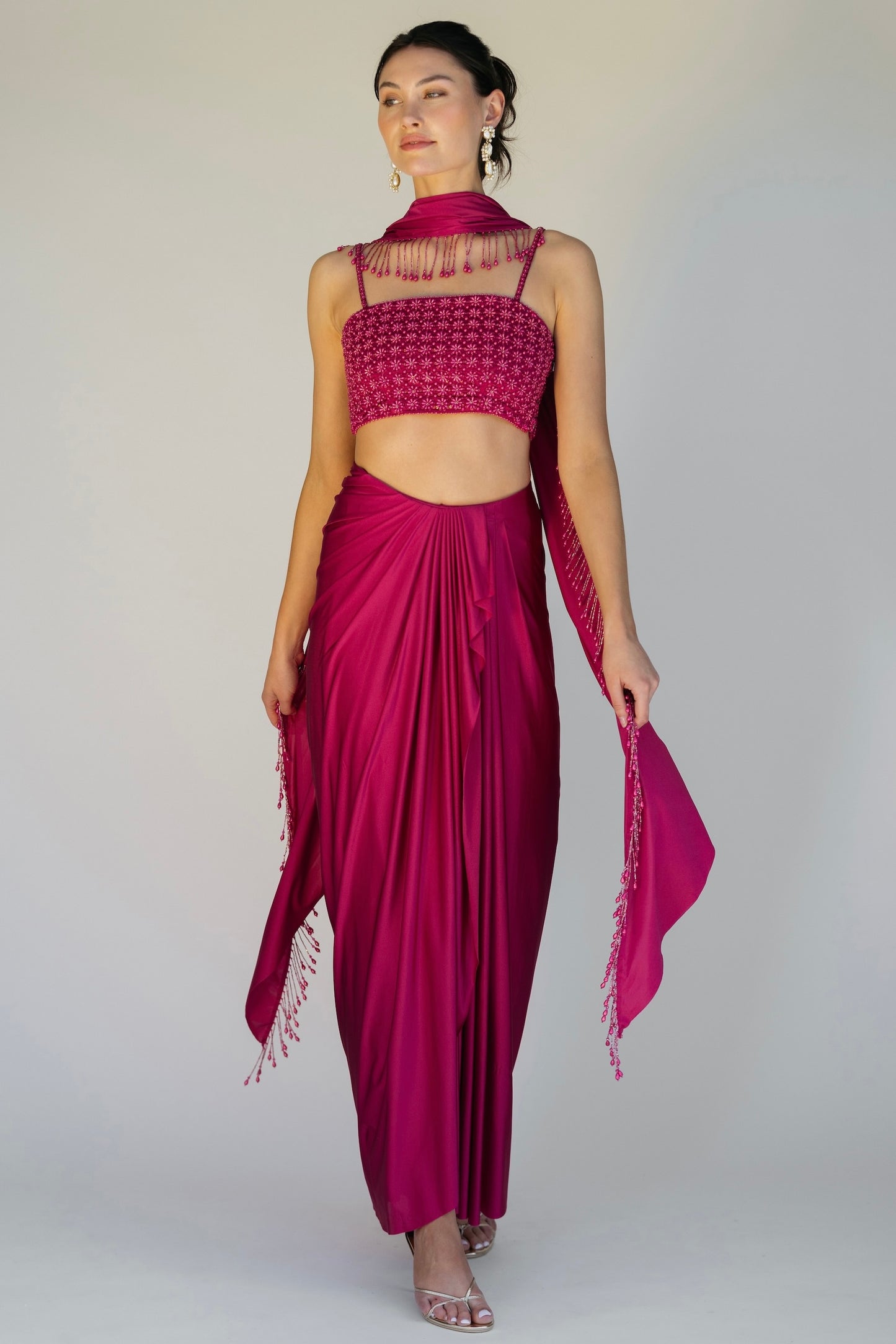The Pearl Set features a hand embroidered pearl top, pleated skirt and skinny dupatta with pearl tassel detailing.