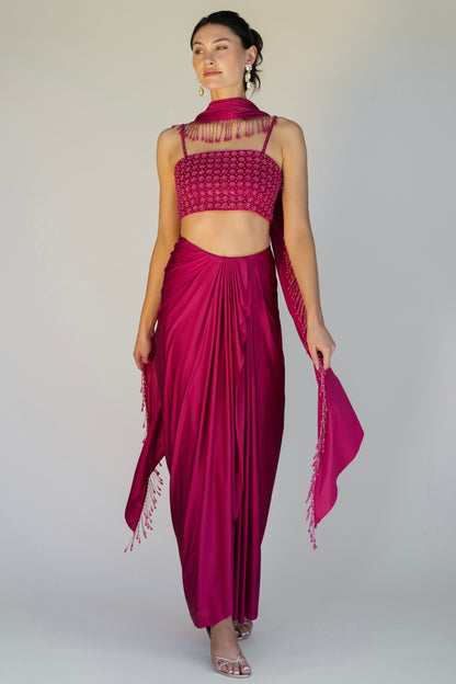 The Pearl Set features a hand embroidered pearl top, pleated skirt and skinny dupatta with pearl tassel detailing.