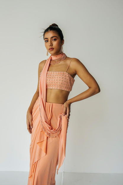 The Pearl Set is a hand embroidered pearl top, gathered skirt and skinny dupatta with pearl detailing.