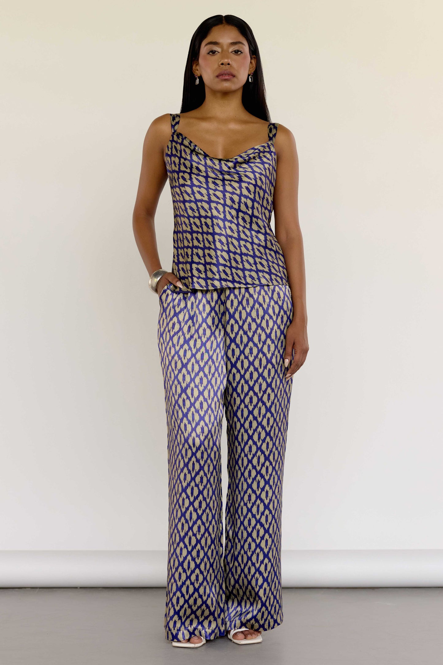 The Uma Pant features a vintage-inspired ikat print, drawn from a 1970s Indonesian handwoven ikat cotton scarf. With an adjustable waistband and a relaxed straight leg, these machine-washable pants pair effortlessly with the Uma Top or your favorite white top.